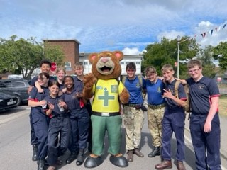 SCAS mascot 999 Ted standing with public