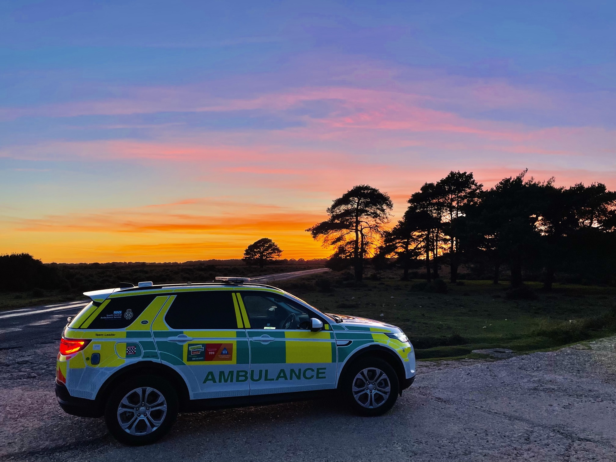 Ambulance response car parked in the New Forest at sunset